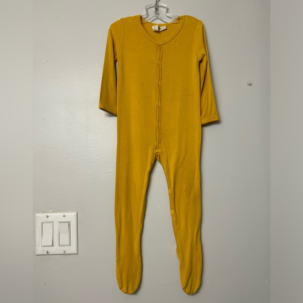 Kyte Retired Mustard Snap footie. From 2018. Size 12-18m